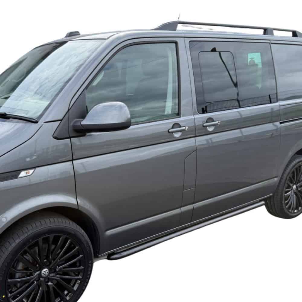 Side view of a grey VW T5 T6 van fitted with black side bars, showcasing the vehicle's sporty accessories.