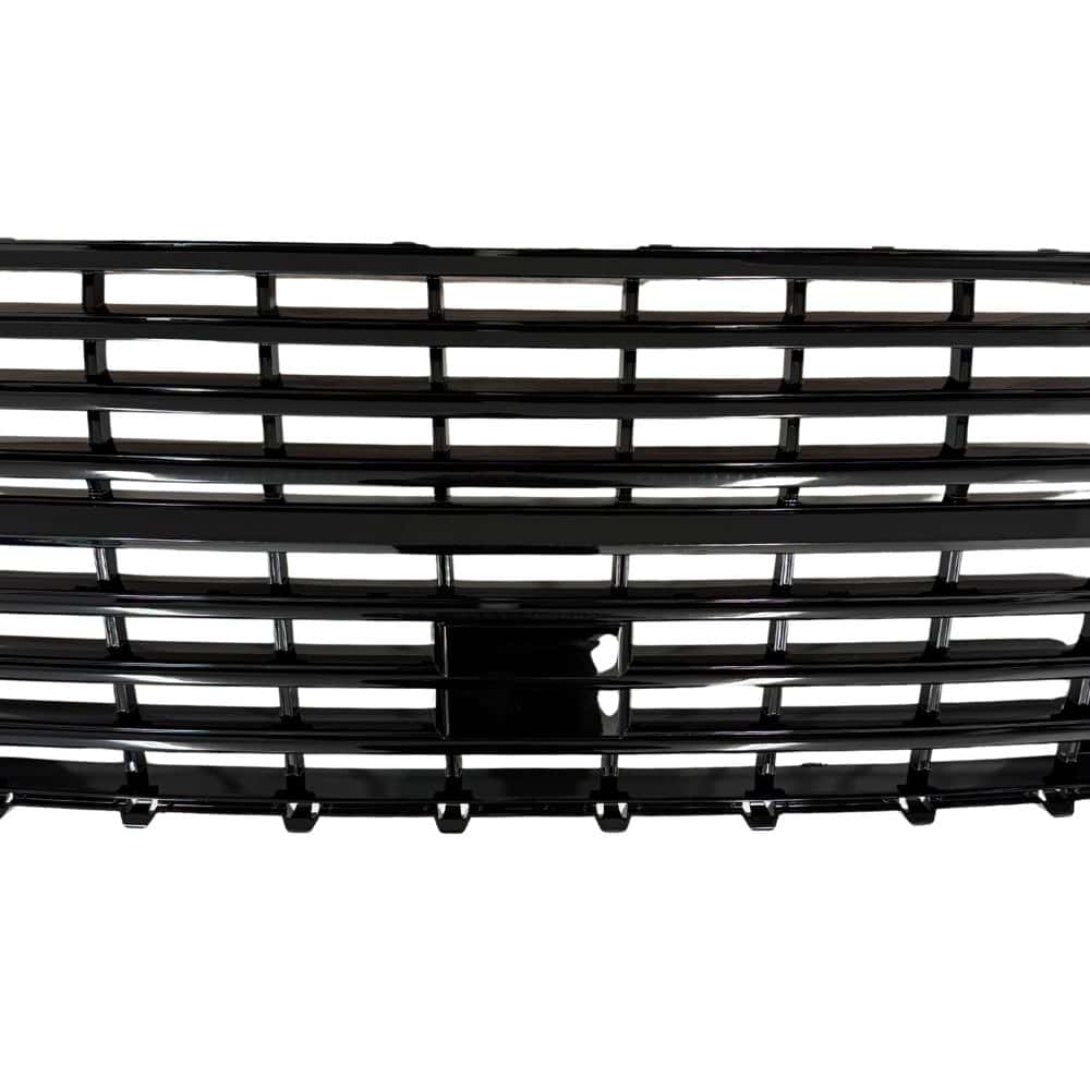 Close-up of a T6.1 van's gloss black badgeless grille, showcasing a sleek, modern design with horizontal slats for a stylish upgrade.